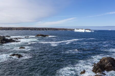 An iceberg along the Newfoundland coastline in summer, very popular with tourist.の写真素材