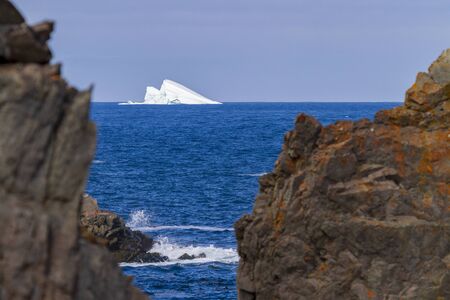 An iceberg along the Newfoundland coastline in summer, very popular with tourist.の写真素材