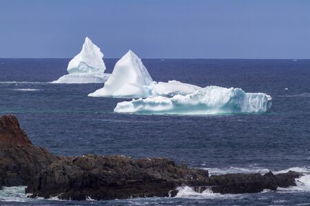 An iceberg along the Newfoundland coastline in summer, very popular with tourist.の写真素材