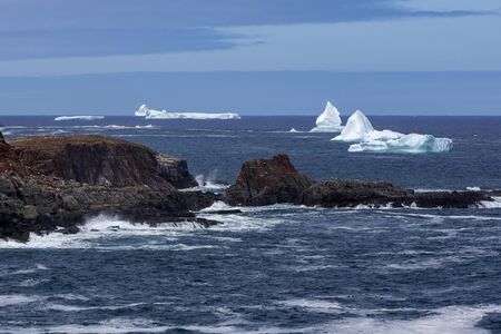 An iceberg along the Newfoundland coastline in summer, very popular with tourist.の写真素材