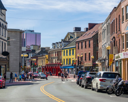 ST. JOHN'S, NEWFOUNDLAND AND LABRADOR, CANADA â September 2, 2019: Water Street in downtown St. Johnâs showing its colorful building and activities, taken on September 2, 2019 in St. John's.のeditorial素材