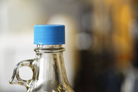 Chemical bottle with a protective blue cap preventing leakage and spillage.の写真素材