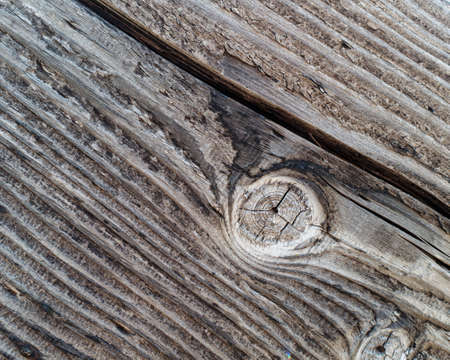 Coal tar treated wooden plank showing weathering.の写真素材