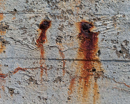 Close up of aged concert showing weathering and discoloration.