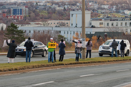 ST. JOHN'S, NEWFOUNDLAND AND LABRADOR, CANADA â NOVEMBER 20, 2021.  Citizens protesting vaccine mandates for COVID at the Newfoundland and Labrador House of Assembly (Confederation Building), taken on November 20, 2021, in St. John's.のeditorial素材