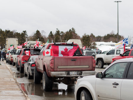 ST. JOHNâS, CANADA, JANUARY 29, 2022: Trucks taking part in the anti-vaccine mandate protest, taken in St. Johnâs, Newfoundland and Labrador on January 29, 2022.のeditorial素材