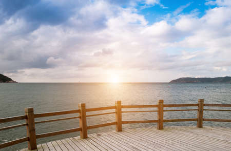 Dreaming on a empty wooden pierの写真素材