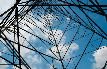 High voltage lines against a background of cloudy sky