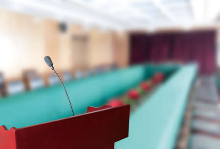 before a conference, the microphones in front of empty chairs.の写真素材