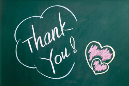 Thank You handwritten with white chalk on a blackboard.の写真素材