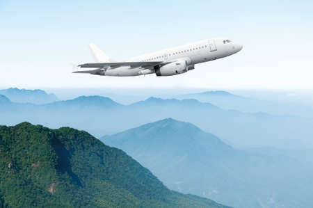 Passenger airliner flight in the blue skyの写真素材