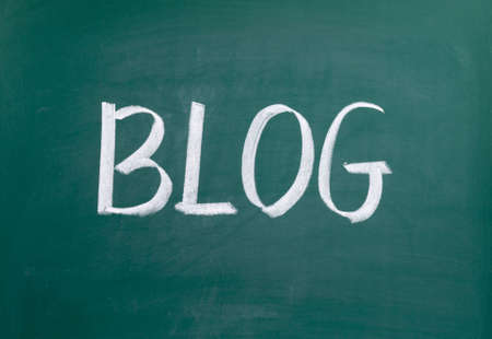 Blog word handwritten on the black chalkboardの写真素材