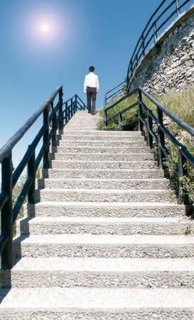 businessman walking near ladder in sky