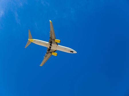 Landing airplane in the blue skyの写真素材