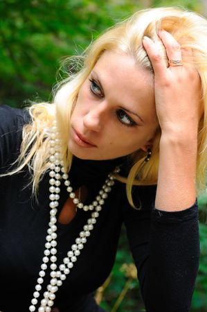 Sad blonde woman in black jerseyの写真素材