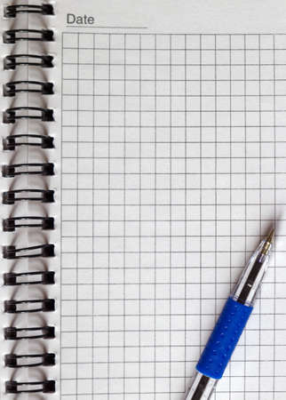 open notebook and a pen close-upの写真素材