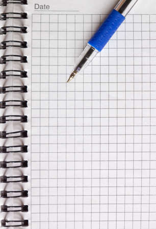 open notebook and a pen close-upの写真素材