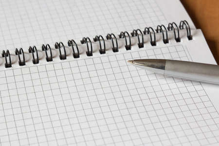open notebook and a pen close-upの写真素材