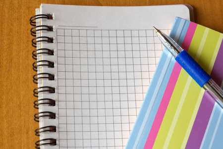 open notebook and a pen on office tableの写真素材
