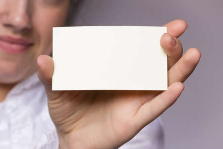 female hand holding a cardの写真素材