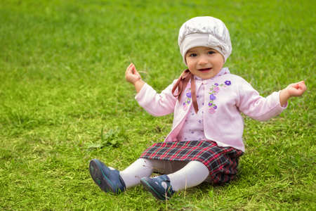 girl on the green grass の写真素材