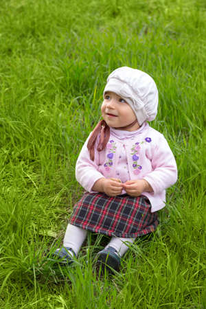 girl on the green grass の写真素材