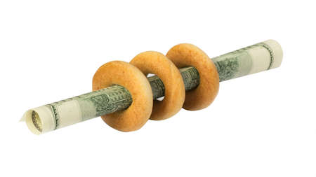 bagels with dollars on whiteの写真素材