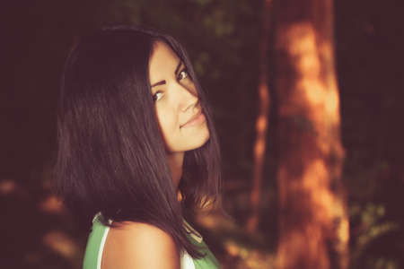 young woman in the park in autumnの写真素材
