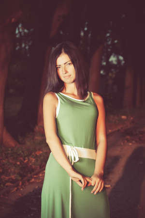 young woman in the park in autumnの写真素材