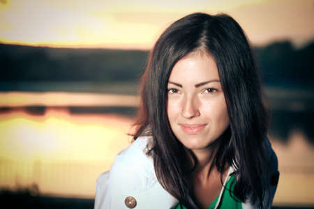 young woman in the park in autumnの写真素材