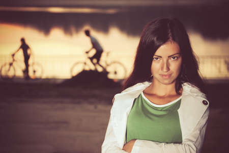 young woman with cyclers on backgroundの写真素材