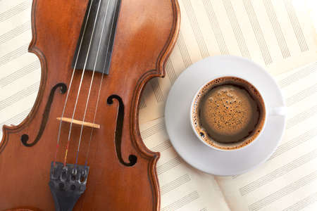 violin background and coffee cup top viewの写真素材