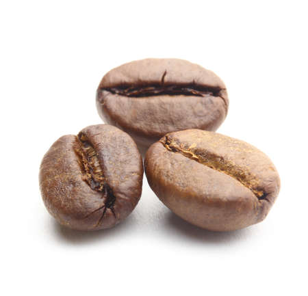 three roasted coffee beans on white backgroundの写真素材
