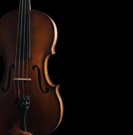 old violin on dark backgroundの写真素材