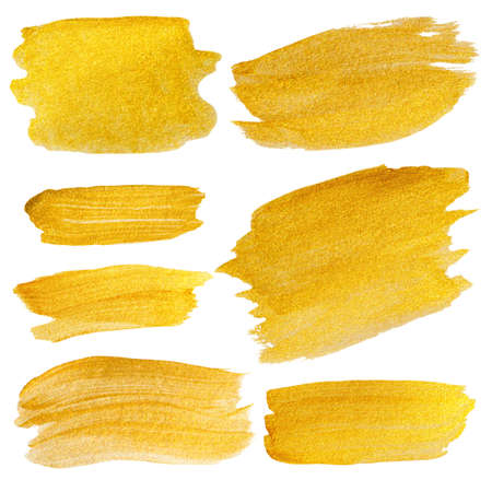 golden texture gouache stains set isolated on whiteの写真素材