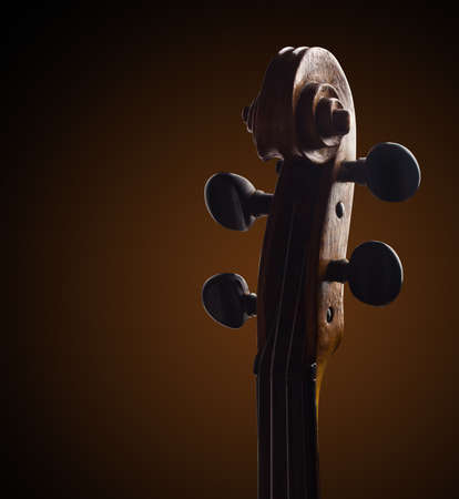 violin neck closeup over brown background