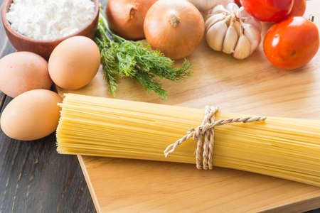 dry pasta spaghetti with ingredientの写真素材