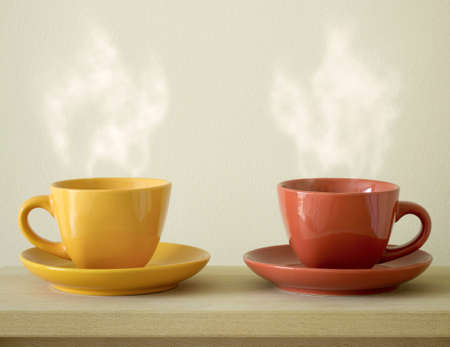steaming coffee cup on tableの写真素材