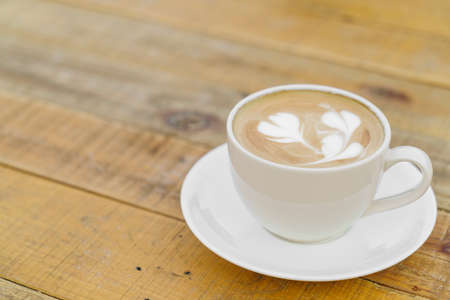 Latte Coffee art on the wooden table