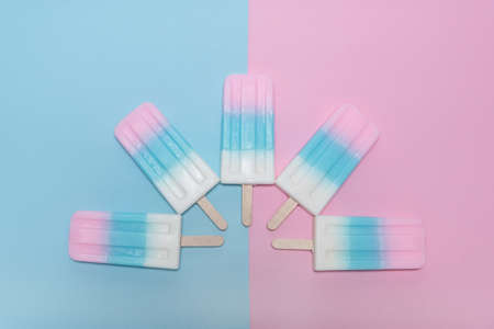 Ice cream over blue and pink background
