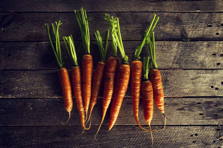 Food Organic Vegetable Colorful Background. Tasty Fresh Carrots on Wooden Table. Top View with Copy...