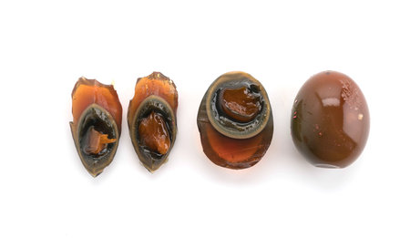 preserved eggs on white backgroundの写真素材