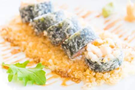 Selective focus point on Tempura sushi maki in white plate - Japanese food styleの写真素材