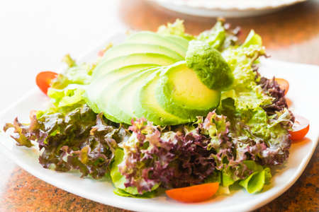 Fresh Avocado salad with vegetable - Healthy food style