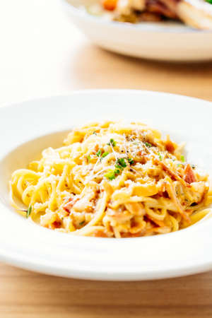Spaghetti carbonara with ham in white plate - Italian food styleの写真素材