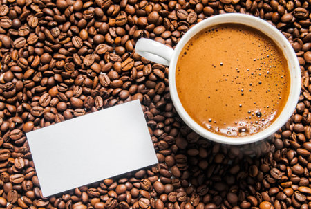 Coffee cup and coffee beans on table, top view, love coffee, Brown coffee beans isolated on white background, Hot Coffee cup with Coffee beansの写真素材