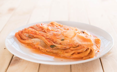 kimchi on wood background - korean foodの写真素材