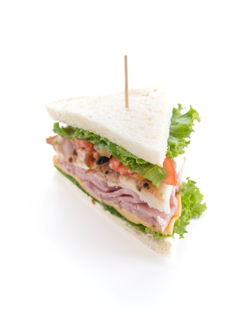 chicken and ham sandwich on white backgroundの写真素材