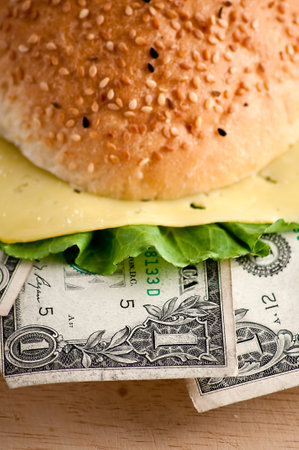 US dollars in a hamburger bun, close-upの写真素材