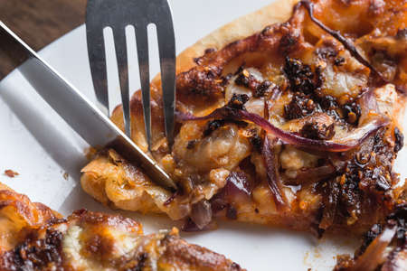 Delicious italian pizzas served on wooden tableの写真素材